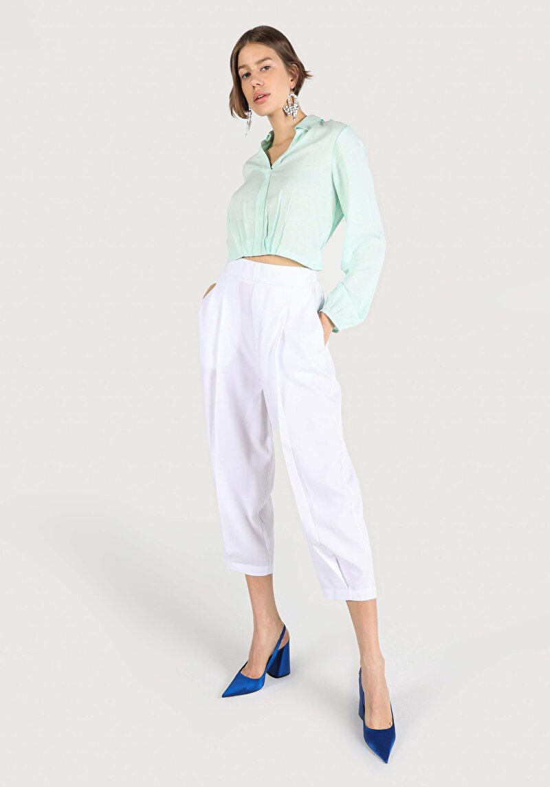 Изображение Женские белые брюки с высокой посадкой и широкими штанинами