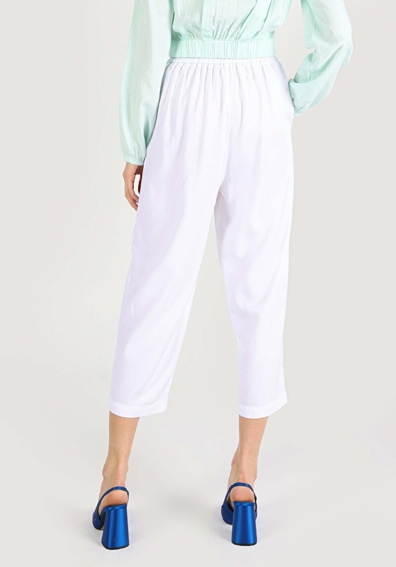 Показать информацию о Женские белые брюки с высокой посадкой и широкими штанинами